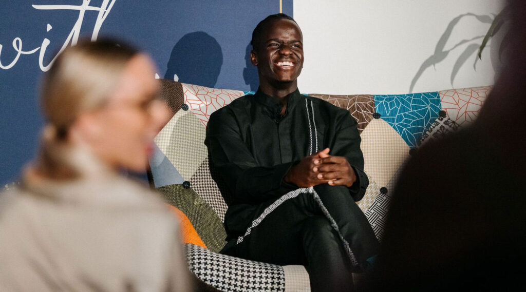 Duku smiling at the audience