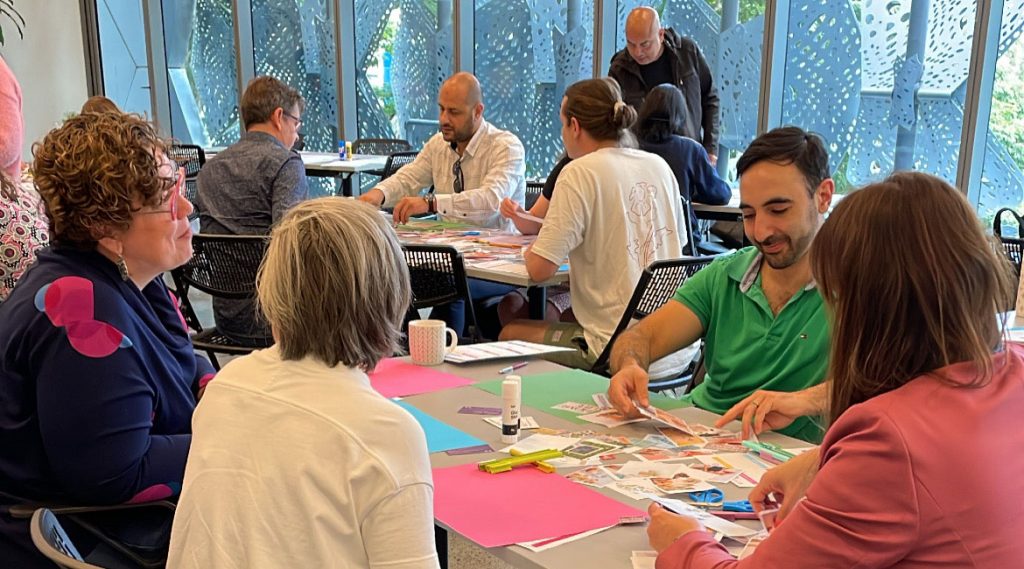 Attendees working on their vision boards