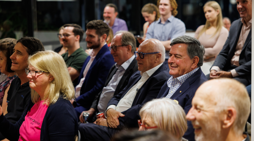 Guests smiling in the audience at On The Couch with Brett Clark